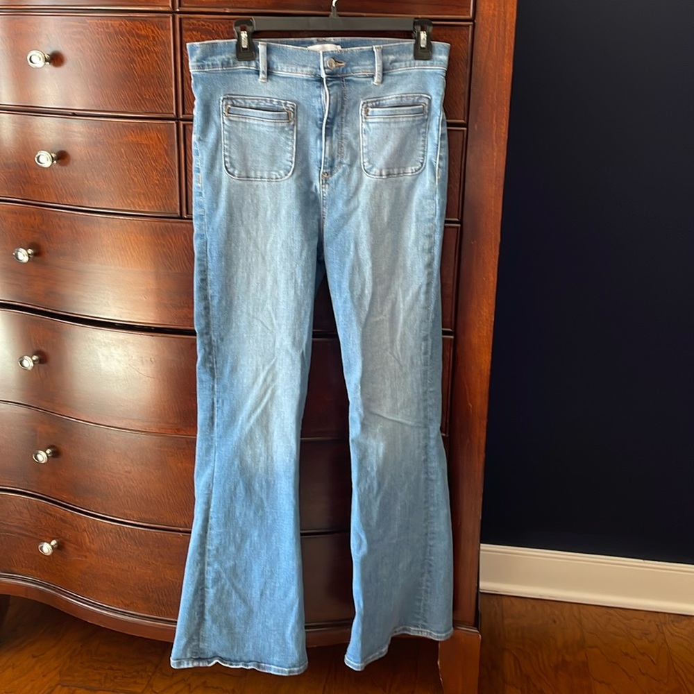 Hi rise medium wash flare jeans.
